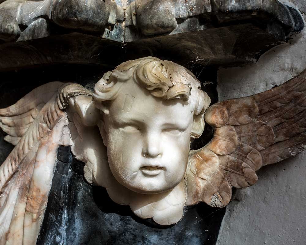 Detail of a memorial inside the church of St John at Oxborough